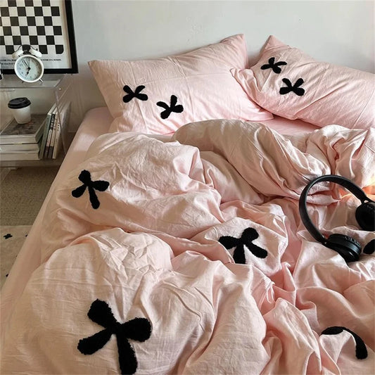 Bedding Pink Black installed on a bed standing in a bedroom
