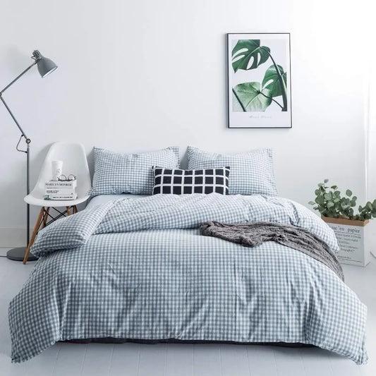 Bed standing in a bedroom with a nordic decor fitted with a Light Blue and White Bedding set