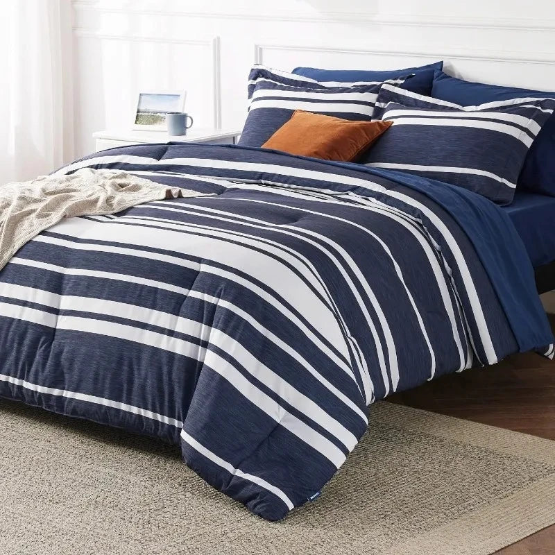 Bed standing on a rug fitted with a Navy Blue Bedding set