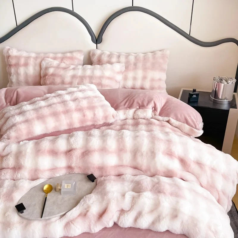 Blankets and pillows fitted with Pink Velvet Bedding and decorative elements placed onto them